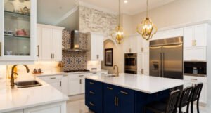  A modern kitchen featuring white cabinets and striking blue countertops.
