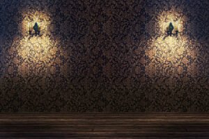 An empty room featuring two wall-mounted lamps and a wall painting.