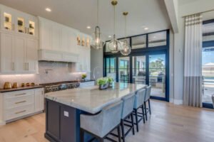 A spacious kitchen featuring a central island and a large dining area, designed for cooking and entertaining by expert kitchen remodelers Plainfield IL.