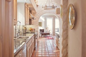 A modern kitchen featuring a sleek sink and countertop, showcasing custom home remodeling design.