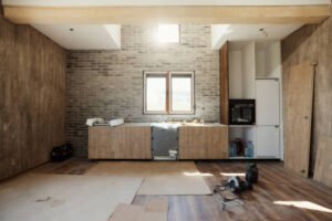 Elegant kitchen design with white cabinetry and polished wooden floors, creating a welcoming and spacious atmosphere.